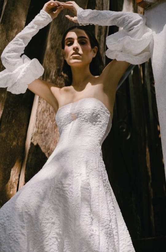 Young model wearing a white brial gown with accessories